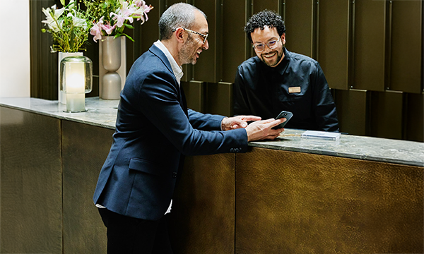 Guest checking in at the front desk at The Ritz-Carlton, Sarasota.