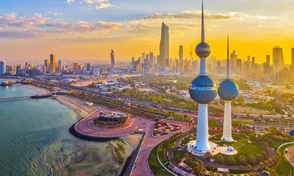 Kuwait City, Kuwait, featuring the Twin Towers, a bridge, a building, and a cityscape at sunset.