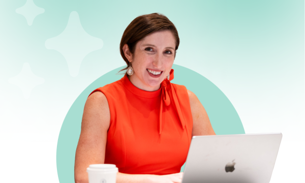 picture of a woman smiling at a laptop on a creative green background