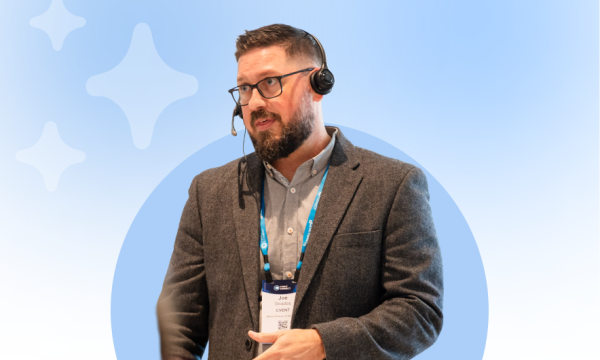 Picture of a man wearing a headset on a creative blue back ground