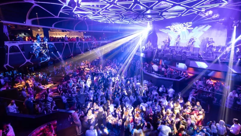 Huge crowd of people in the middle of the dance floor at Tao Nightclub.