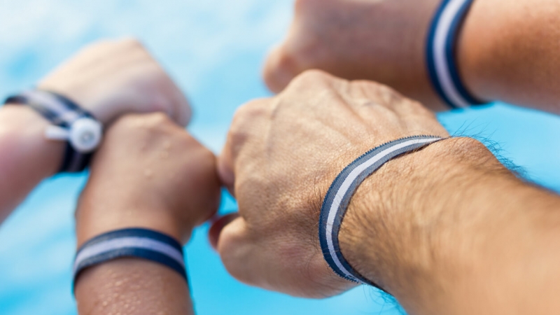 family wearing wristbands at all-inclusive resort