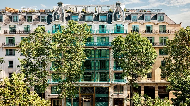 St Honore, an elegant building in Paris, showcases lush landscaping and intricate architectural details.