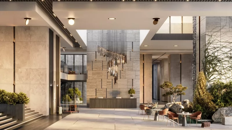 Hotel interior with spectacular chandelier, modern architecture, lush landscaping, and inviting ambiance.