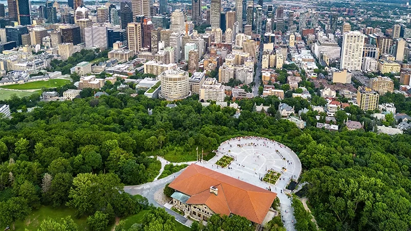 Aerial view of Montreal city with Maison symphonique and green park in the foreground.