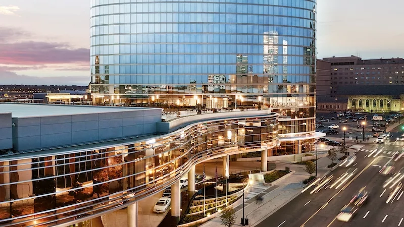 The entry of the JW Marriott Essex House is a stunning blend of modern architecture and elegant landscaping.