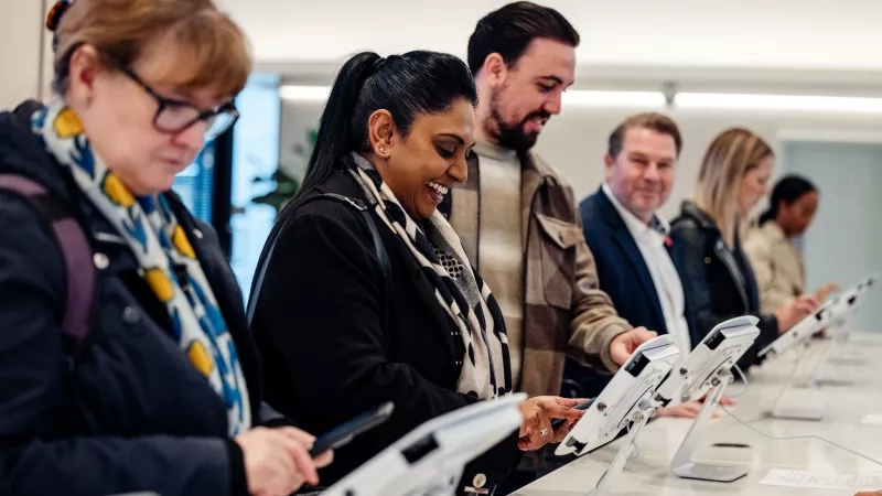 B2B Marketing Event Attendees at Cvent CONNECT Europe 2024 using tablets on a table.
