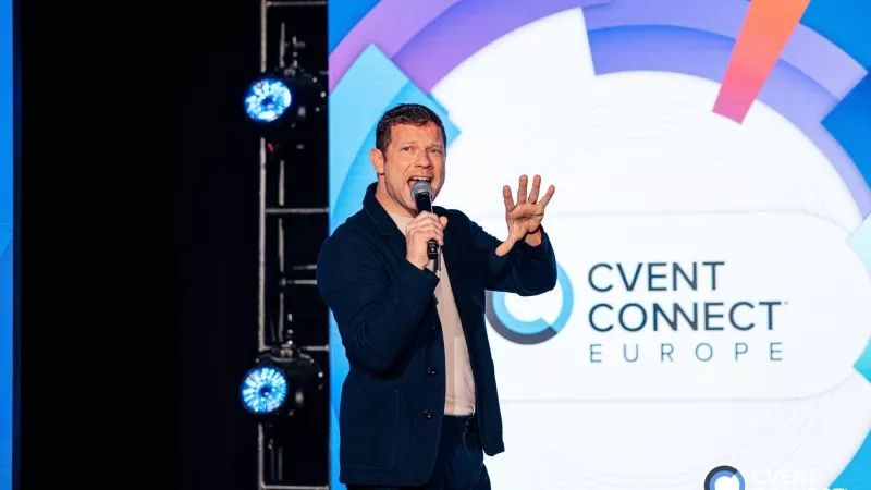 Dermot O'Leary holding a microphone at Cvent CONNECT Europe