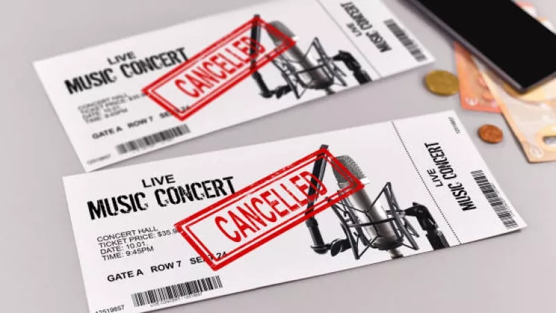 Concert tickets with cancelled written on it