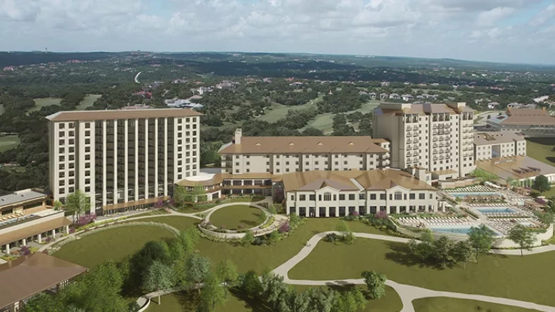 An aerial view of JW Marriott San Antonio Hill Country Resort & Spa, showcasing its architecture and landscaping.