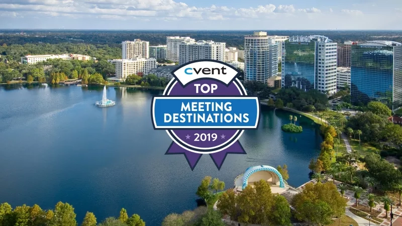 Aerial view of Orlando with a lake, buildings, and "cvent TOP MEETING DESTINATIONS 2019" text.