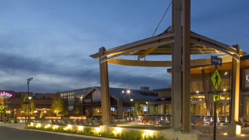 Exterior of Valley Forge Mall at dusk with a gazebo and signage for Davios restaurant