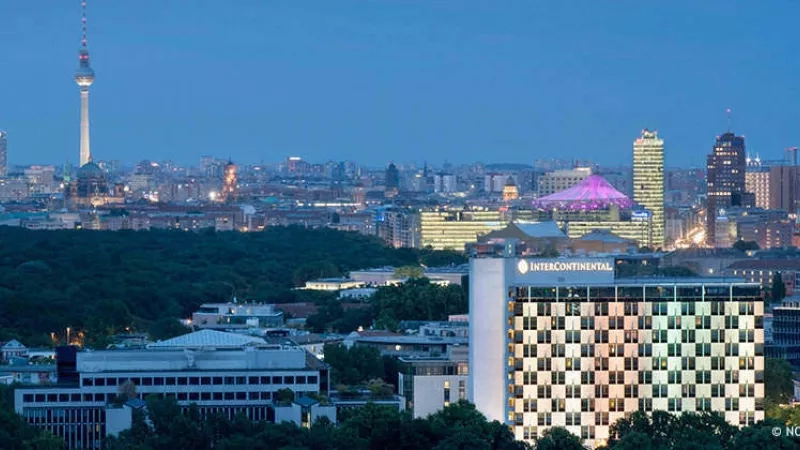 Berlin city view at dusk with the InterContinental Berlin and other buildings in the distance.