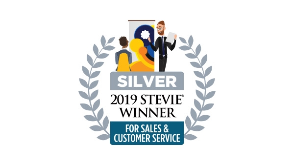 Silver Stevie Winner 2019 for sales and customer service award logo with two people and a trophy.