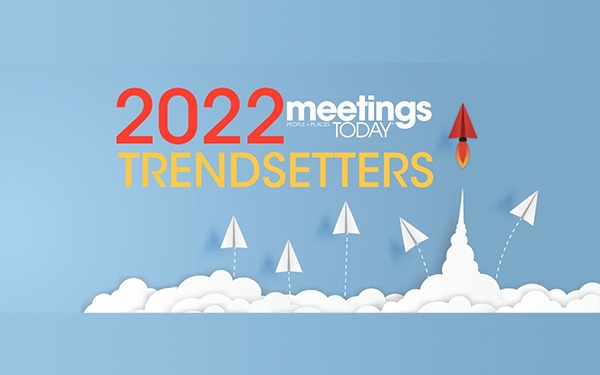 2022 Meeting Today Trendsetters poster with rockets and paper airplanes flying over clouds on a blue background.