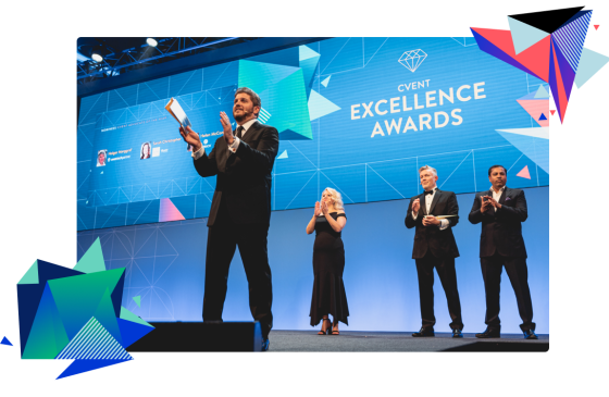 Four people stand on stage as they are being awarded with the Cvent Excellence Awards trophy.