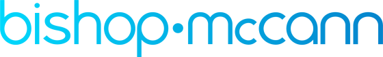 Bishop McCarrick logo in blue with a dot in the middle on a white background.