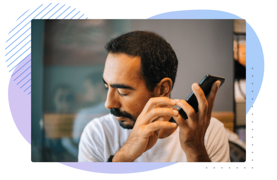 Man on his phone with a black and blue background, with a blue circle and black stripes.