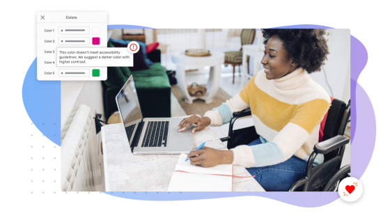 Person in wheelchair working on laptop with a color accessibility alert appearing on the screen.