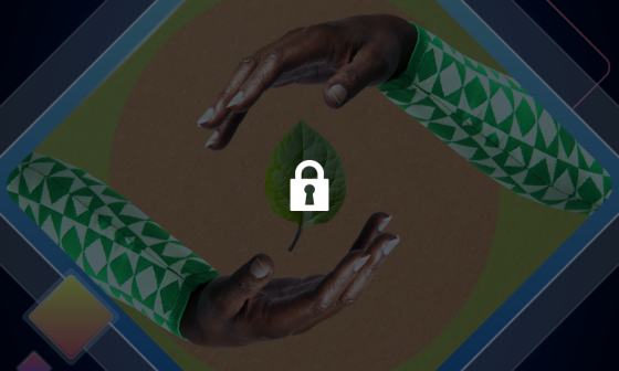 Two hands are placed around a green leaf with a lock on it.