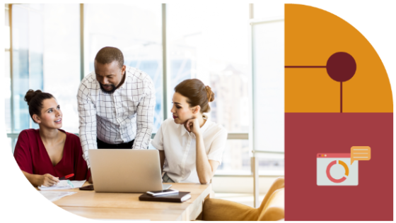 Two women and a man sit at a desk working on a laptop, with a red banner in the background.