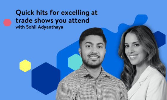 Sohil Adyanthaya, a man and a woman, stand together in front of a blue background.