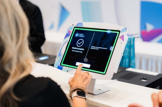 Cvent OnArrival check-in ipad being used by blonde woman