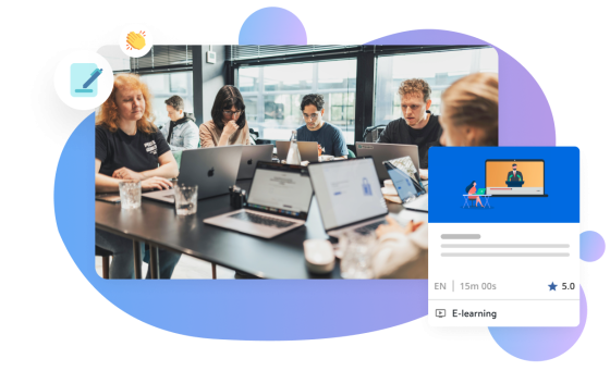 people at a table on their laptops taking learnings