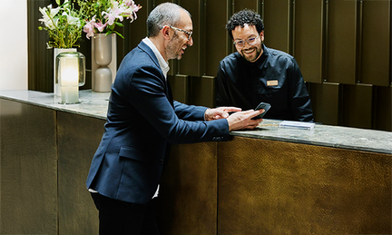 Guest checking in at the front desk at The Ritz-Carlton, Sarasota.