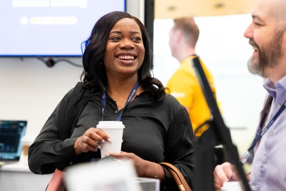 Alkami Technology Co:lab conference attendees laughing with each other