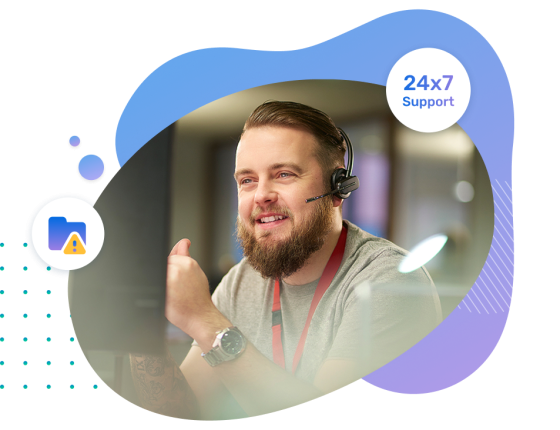 A support person infront of digital screen surrounded by icons like threat security and 24x7 support