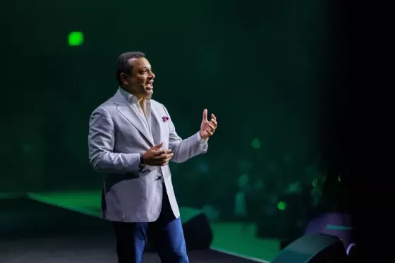 Cvent CEO Reggie on stage at CONNECT