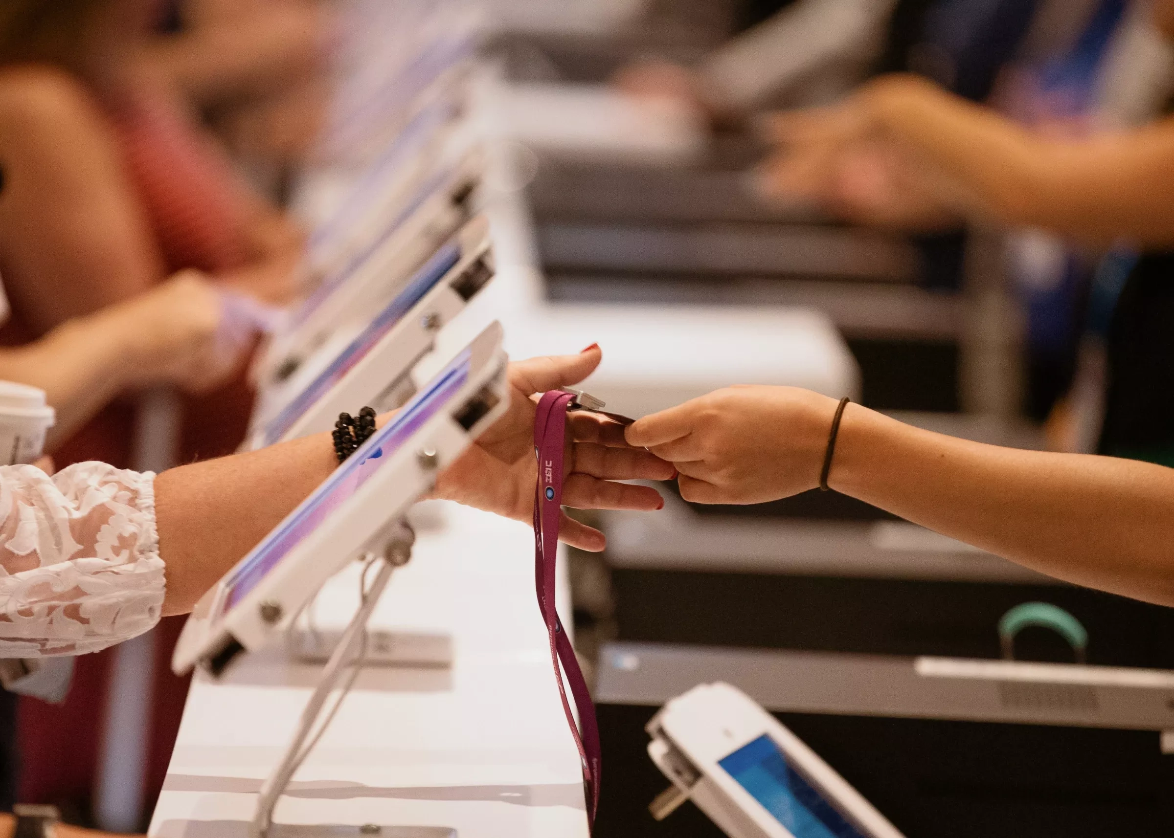 Event checkin station with attendee holding a badge