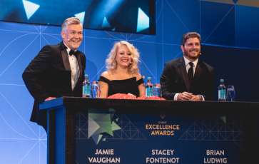 Stacey Fontenot, Jamie Vaughan, and Brian Ludwig on stage at the 2023 Cvent Excellence Awards.
