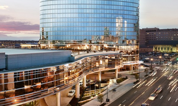 The entry of the JW Marriott Essex House is a stunning blend of modern architecture and elegant landscaping.